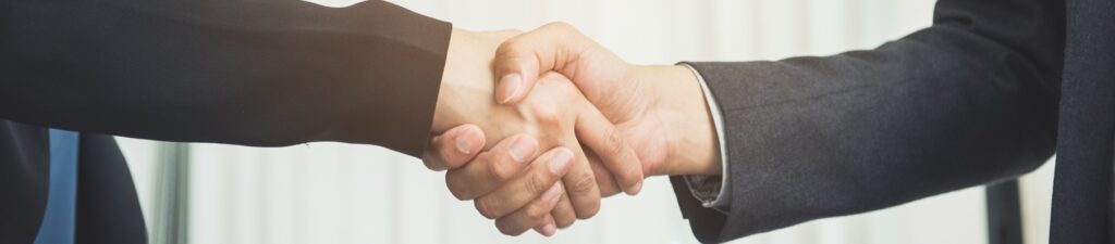 negotiating business,image businesswomen handshake,happy with wo